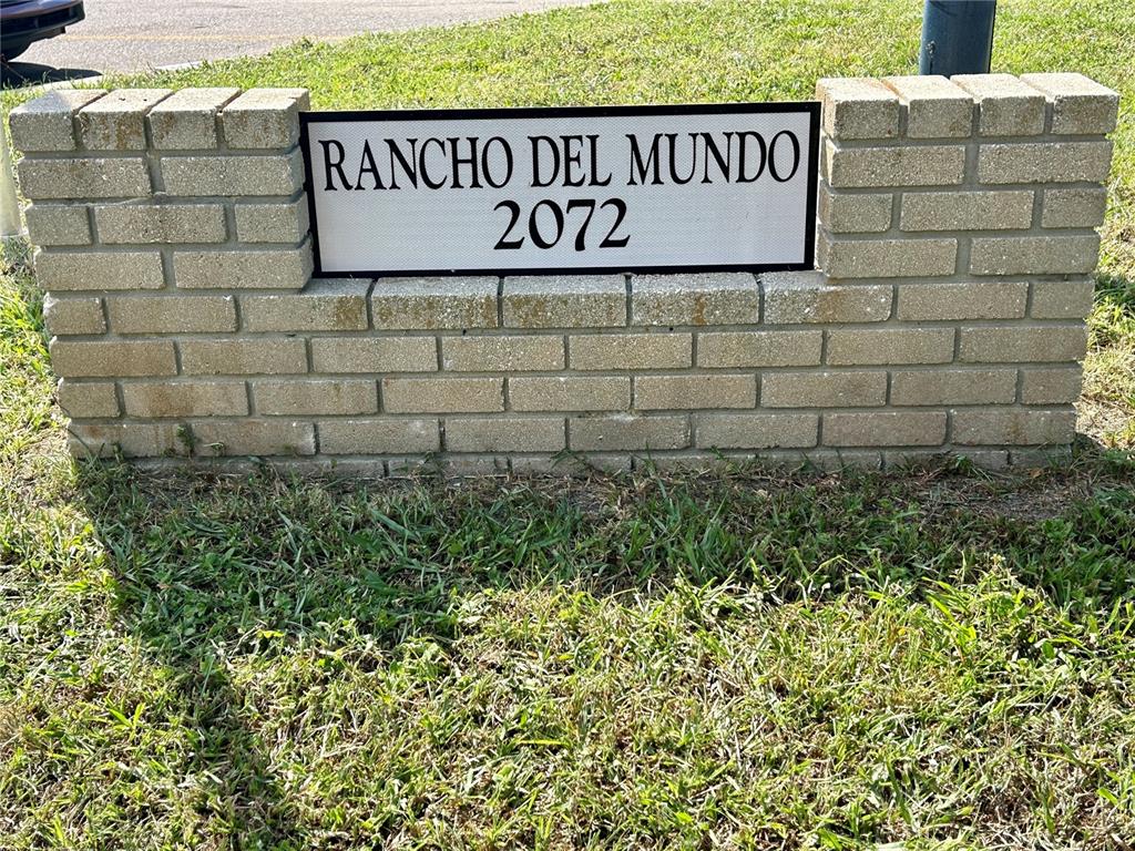 2072 Australia Way West, Unit 32 Clearwater, FL 33763 - Photo 2 of 47 a sign broad in front of a brick wall