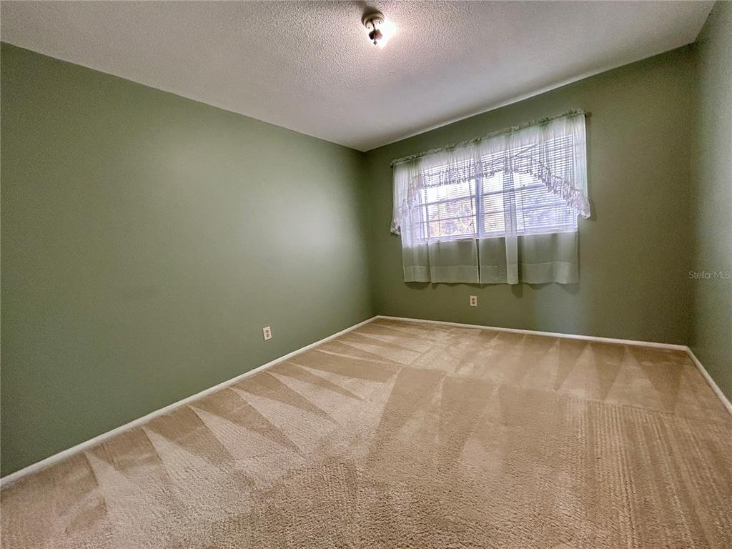 2072 Australia Way West, Unit 32 Clearwater, FL 33763 - Photo 21 of 47 an empty room with a window