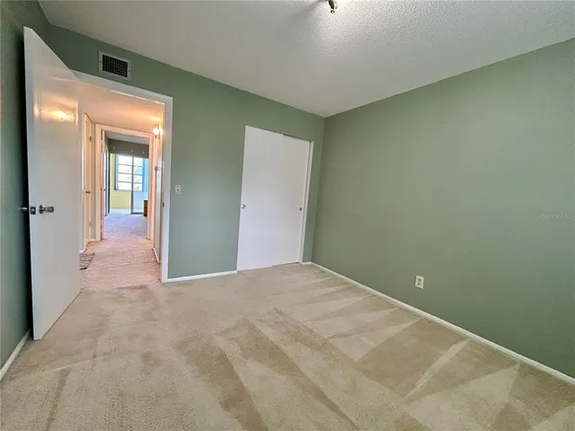 a view of a room with a hallway