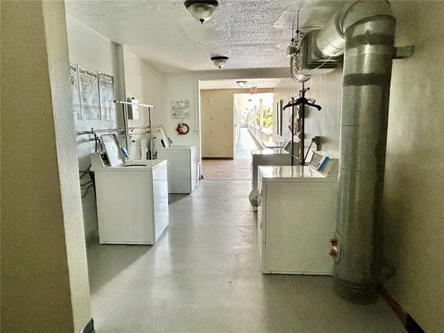 a view of a livingroom with furniture and windows