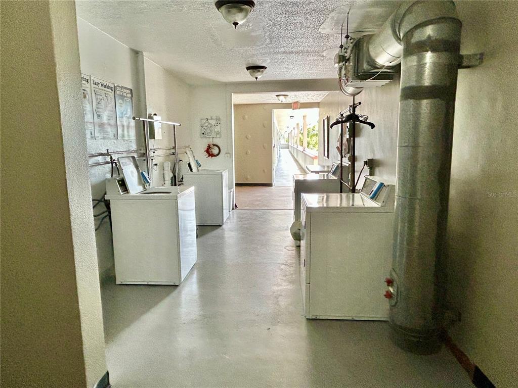 2072 Australia Way West, Unit 32 Clearwater, FL 33763 - Photo 26 of 47 a view of a livingroom with furniture and windows