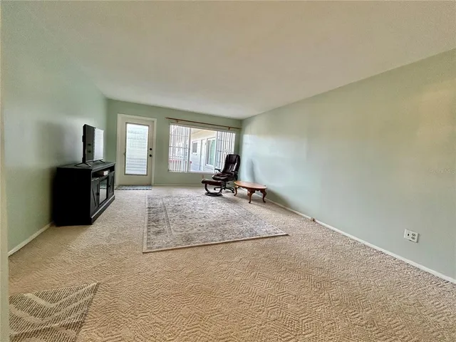 a room with a couch and a flat screen tv