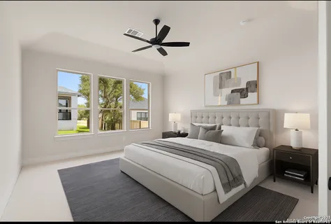 a bedroom with a large bed and a window