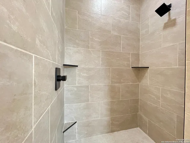 a bathroom with a sink and a shower