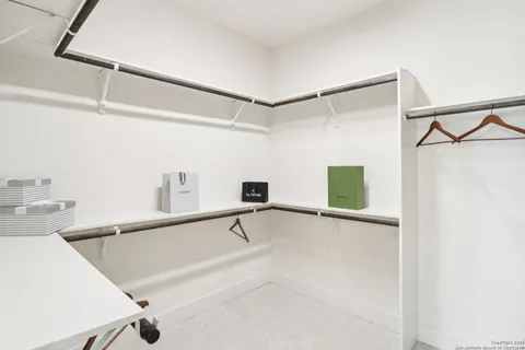 a view of an empty room and a window