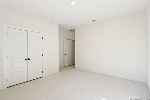 a view of a livingroom with a ceiling fan and window