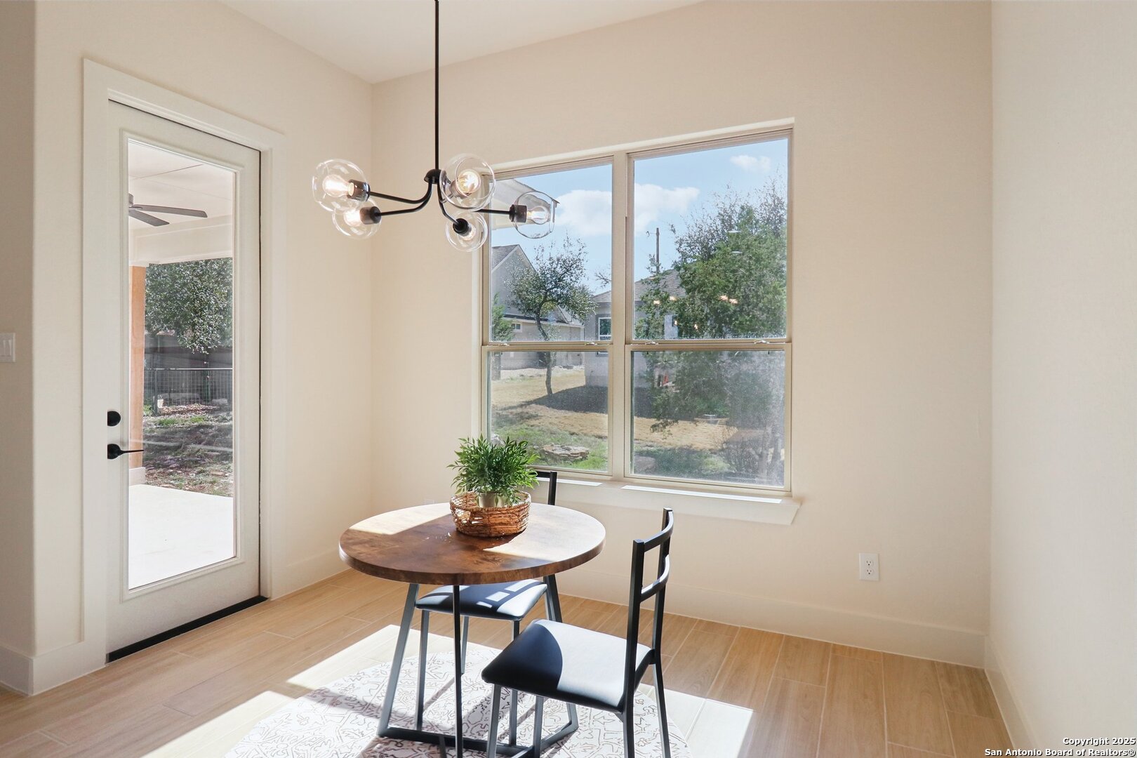 104 George Erath Blanco, TX 78606 - Photo 8 of 28 a view of a dining room with furniture window and wooden floor