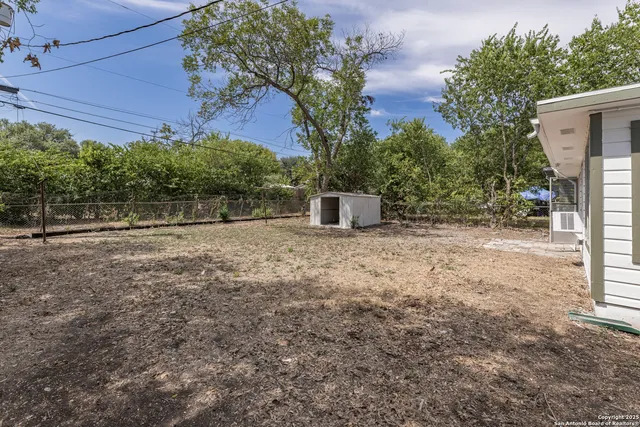 a backyard of a house with lots of green space