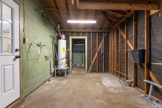 a view of a room with wooden floor and windows
