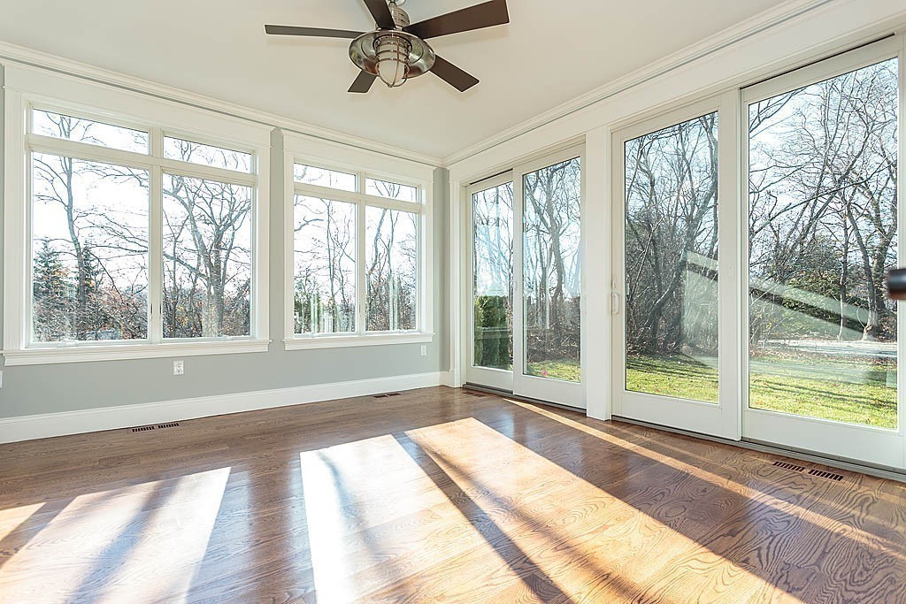 180 Ridge Street Winchester, MA 01890 - Photo 17 of 30 a view of a room with wooden floor and windows