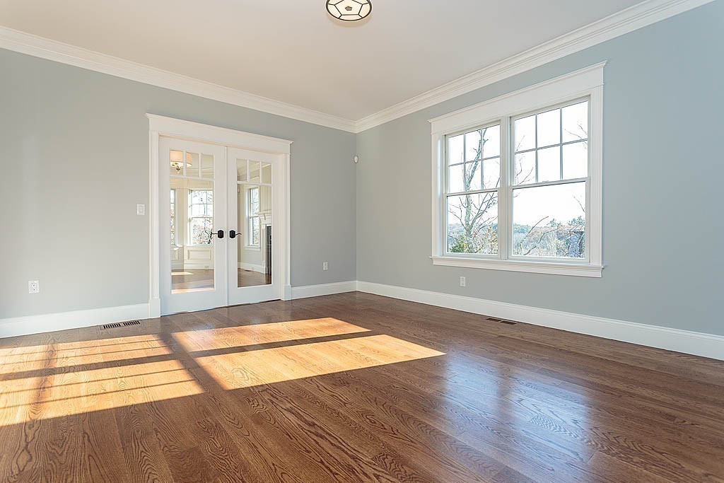 180 Ridge Street Winchester, MA 01890 - Photo 18 of 30 a view of an empty room with wooden floor and a window