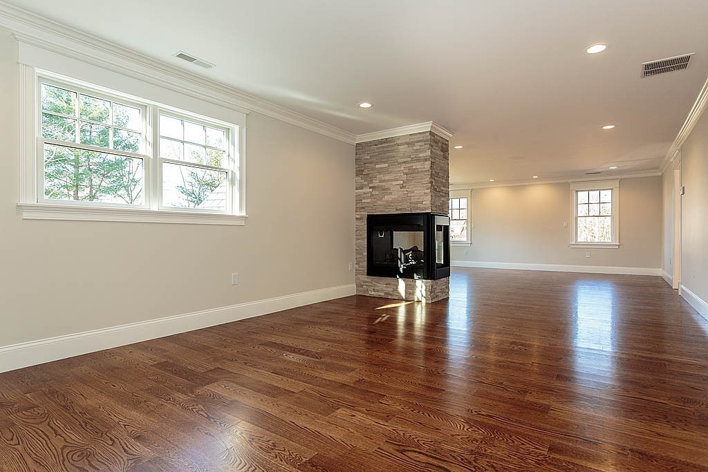 180 Ridge Street Winchester, MA 01890 - Photo 22 of 30 an empty room with wooden floor and windows