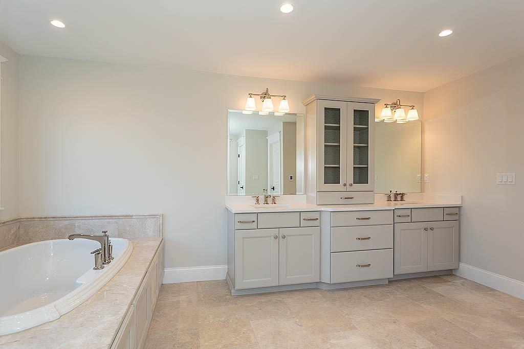 180 Ridge Street Winchester, MA 01890 - Photo 23 of 30 a spacious bathroom with a tub sink and mirror