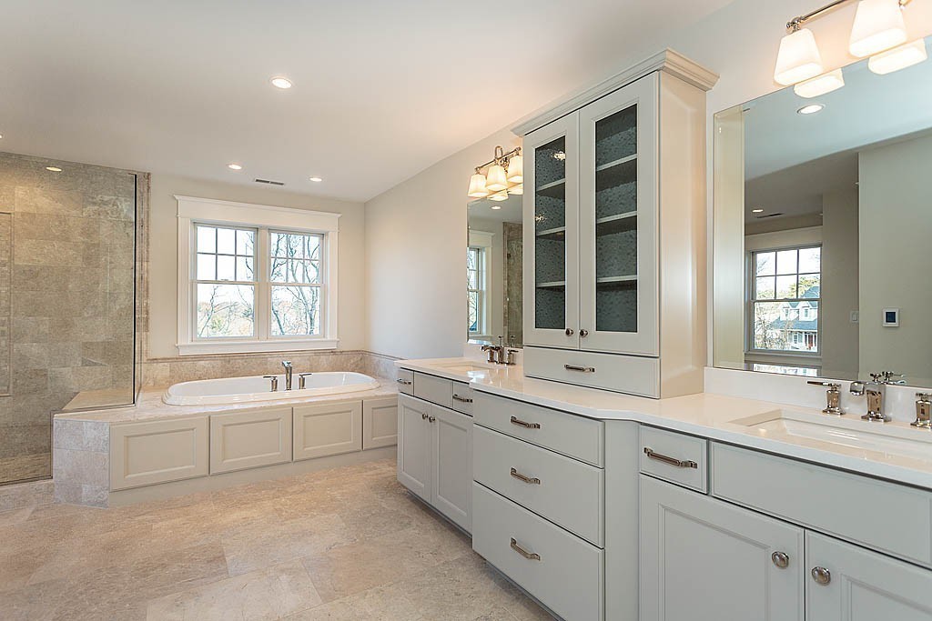 180 Ridge Street Winchester, MA 01890 - Photo 24 of 30 a spacious bathroom with double vanity a window a double vanity sinks and a bathtub