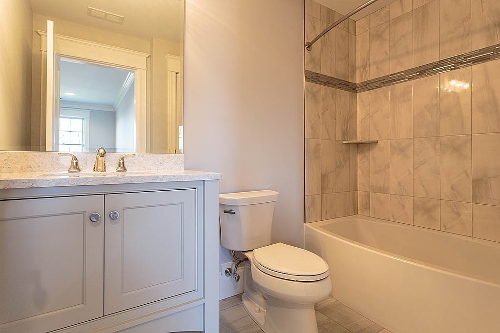 180 Ridge Street Winchester, MA 01890 - Photo 26 of 30 a bathroom with a sink a toilet and shower