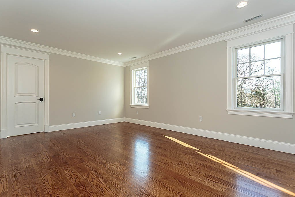 180 Ridge Street Winchester, MA 01890 - Photo 29 of 30 a view of an empty room with wooden floor and a window