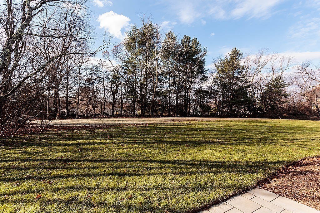 180 Ridge Street Winchester, MA 01890 - Photo 5 of 30 a view of a swimming pool with an outdoor space and seating area