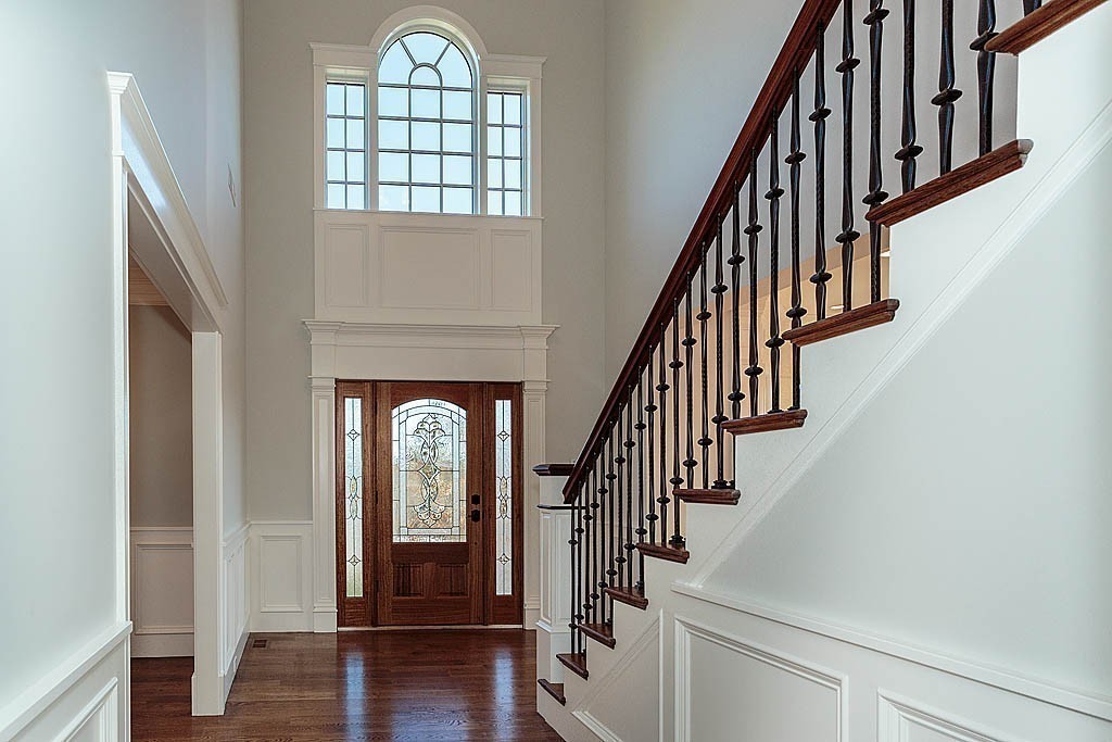 180 Ridge Street Winchester, MA 01890 - Photo 7 of 30 a view of entryway with wooden floor and stairs