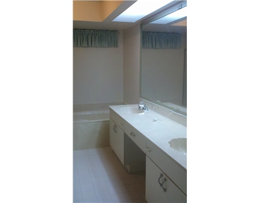 5771 Coach House Circle, Unit B Boca Raton, FL 33486 - Photo 15 of 20 a utility room with a sink and a mirror