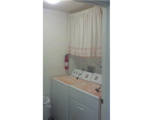 5771 Coach House Circle, Unit B Boca Raton, FL 33486 - Photo 17 of 20 a bathroom with a sink and a vanity