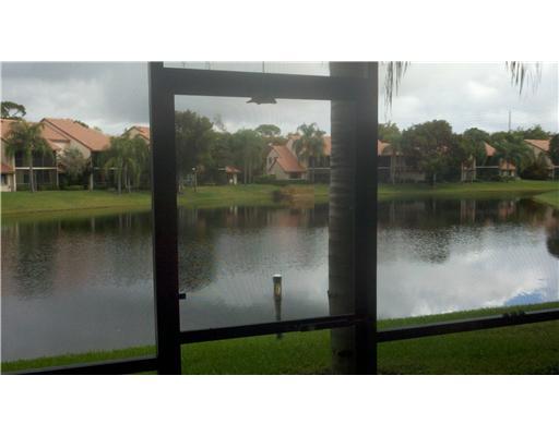 5771 Coach House Circle, Unit B Boca Raton, FL 33486 - Photo 18 of 20 a black and white photo of a lake