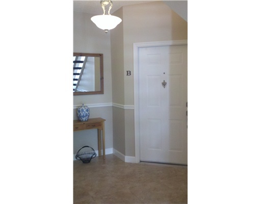 5771 Coach House Circle, Unit B Boca Raton, FL 33486 - Photo 2 of 20 a room with a sink and a mirror