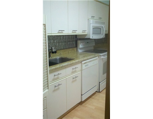 5771 Coach House Circle, Unit B Boca Raton, FL 33486 - Photo 10 of 20 a kitchen with a sink and cabinets