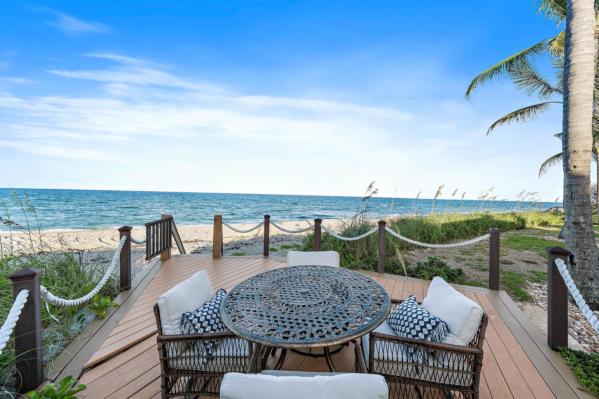 613 South Beach Road Jupiter, FL 33469 - Photo 73 of 74 a terrace with outdoor seating and city view