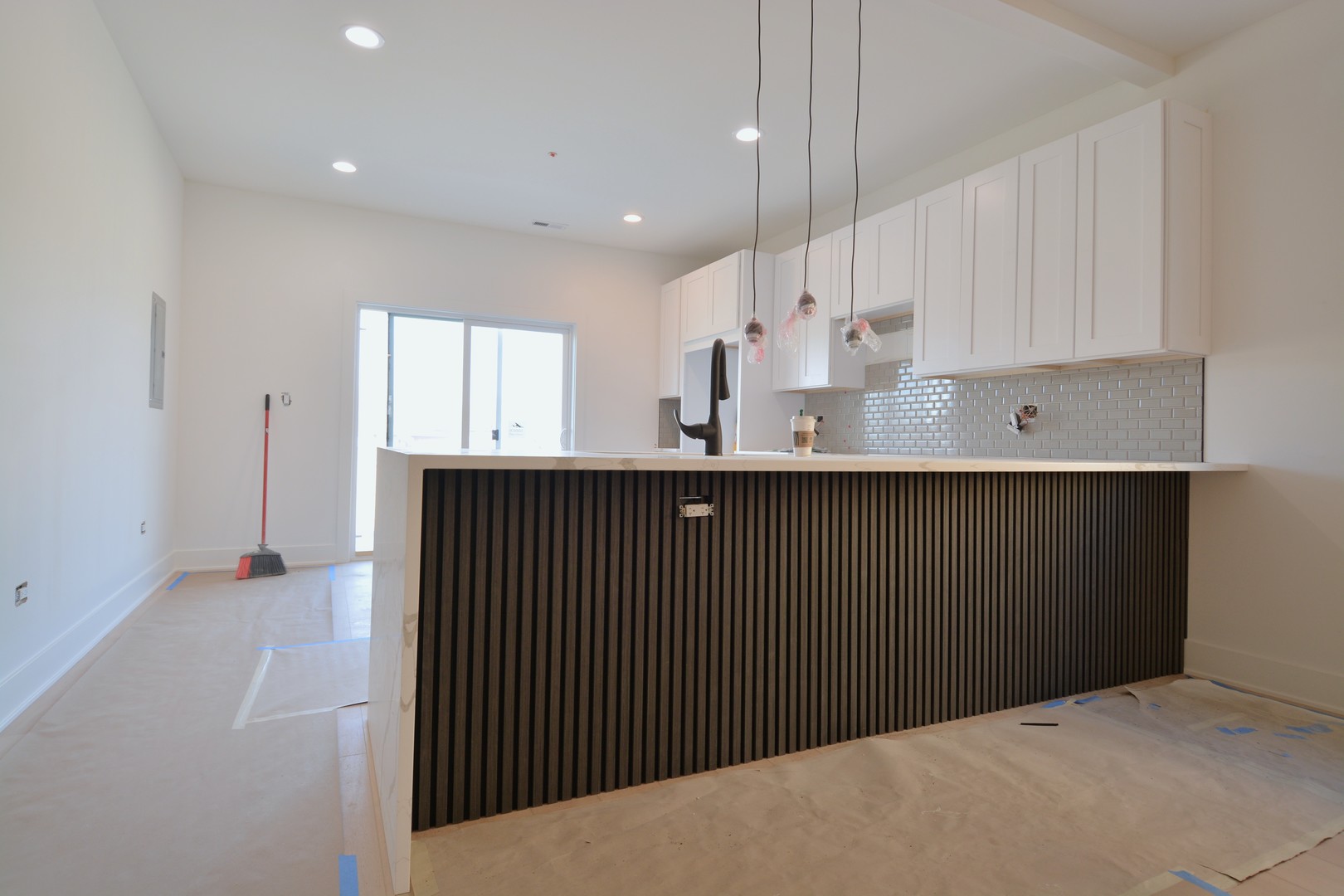 7427 Covington Place Justice, IL 60458 - Photo 6 of 8 a kitchen with kitchen island a sink stainless steel appliances and cabinets