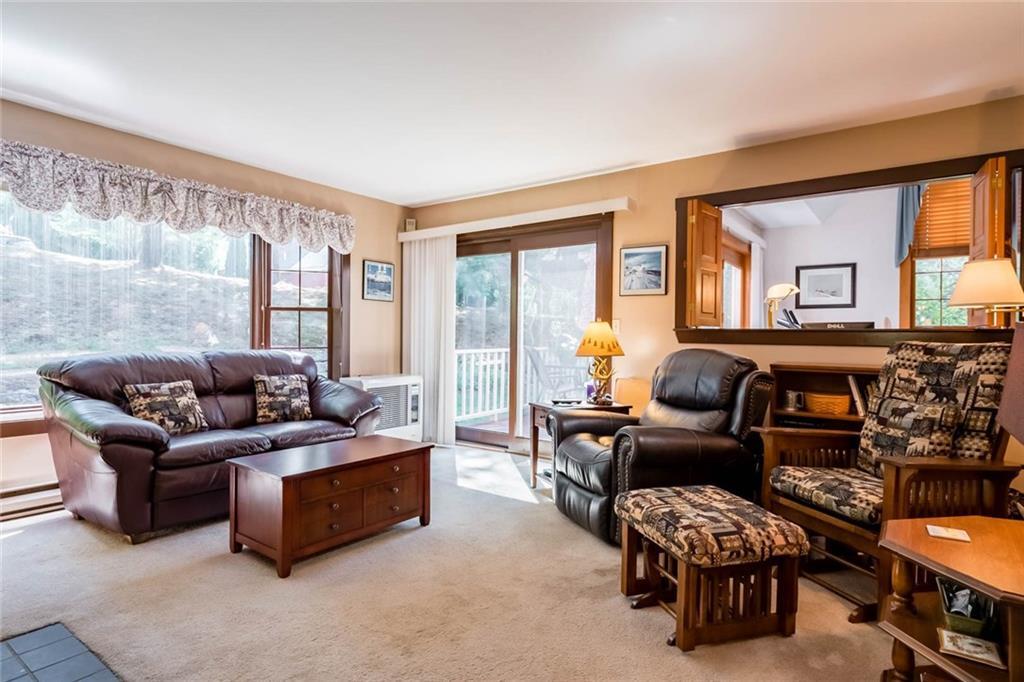 2 Charing Cross Road, Unit 33 Naples, ME 04055 - Photo 11 of 27 Living Room with Fireplace, large...
