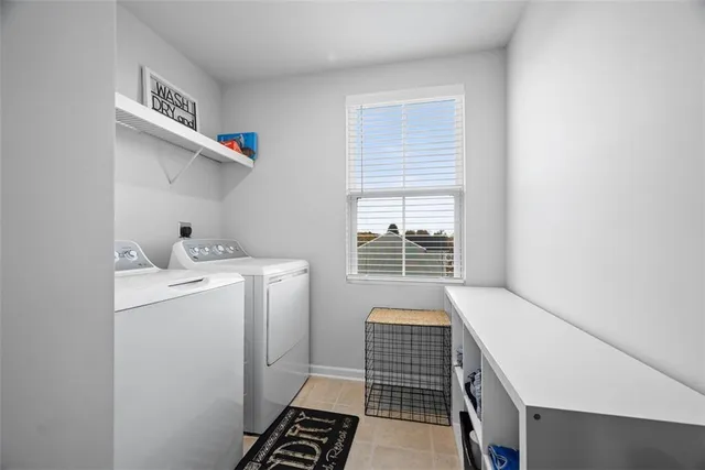 a bedroom with a bed and a view of kitchen