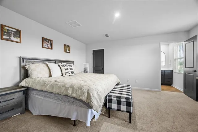 a bedroom with a bed and a cabinets