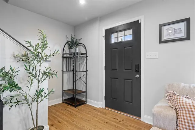 a bedroom with a bed and a potted plant
