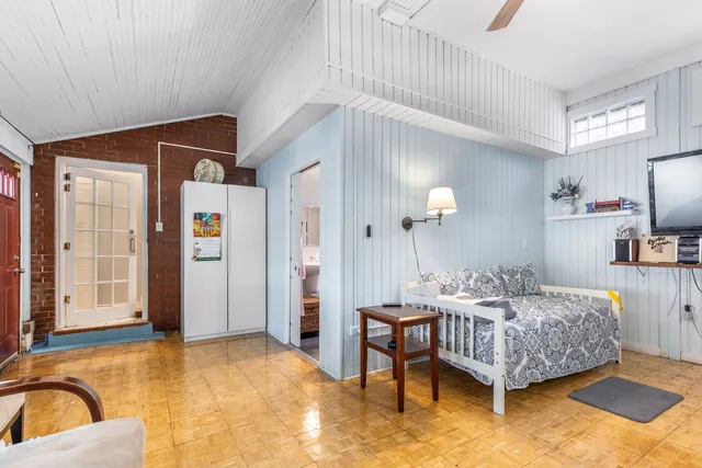 an aerial view of multiple houses with yard