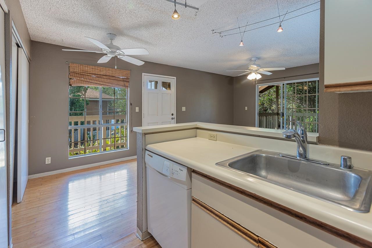 140 Uwapo Road, Unit 24202 Kihei, HI 96753 - Photo 11 of 45 a kitchen with a sink and a large window