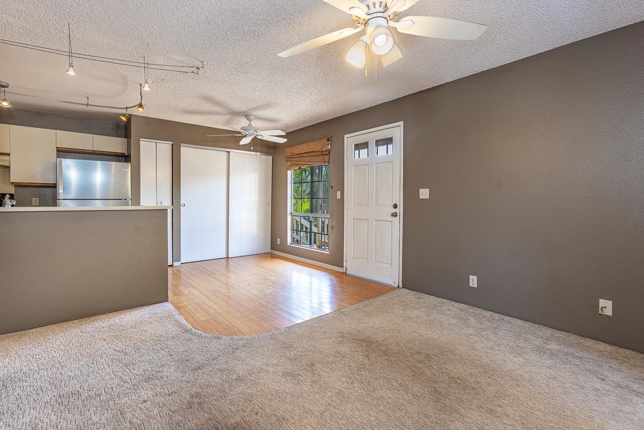 140 Uwapo Road, Unit 24202 Kihei, HI 96753 - Photo 16 of 45 a view of a livingroom with a ceiling fan and window