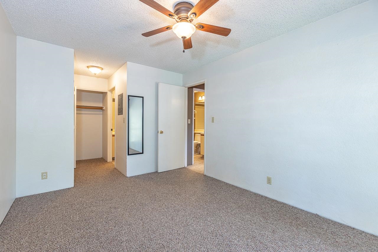 140 Uwapo Road, Unit 24202 Kihei, HI 96753 - Photo 18 of 45 an empty room with closet and a ceiling fan