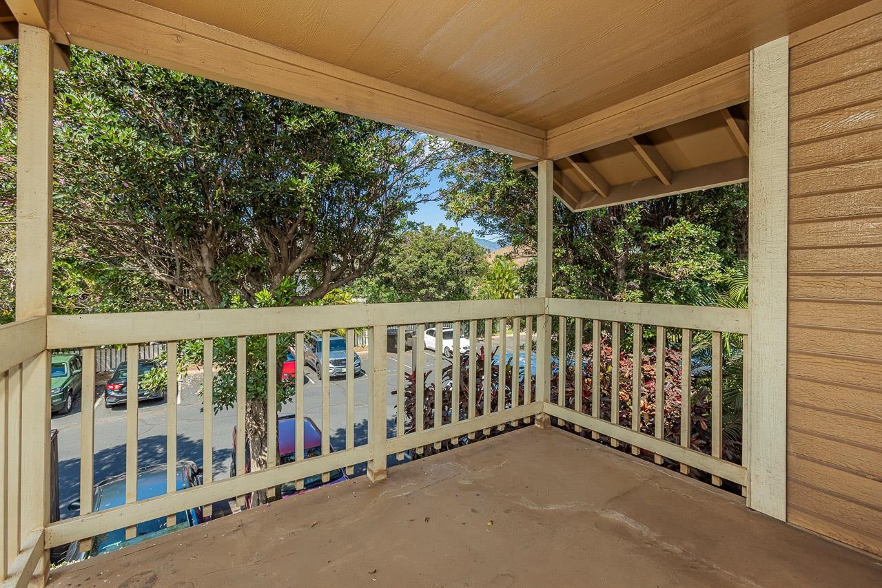 140 Uwapo Road, Unit 24202 Kihei, HI 96753 - Photo 25 of 45 a balcony with wooden floor and outdoor view