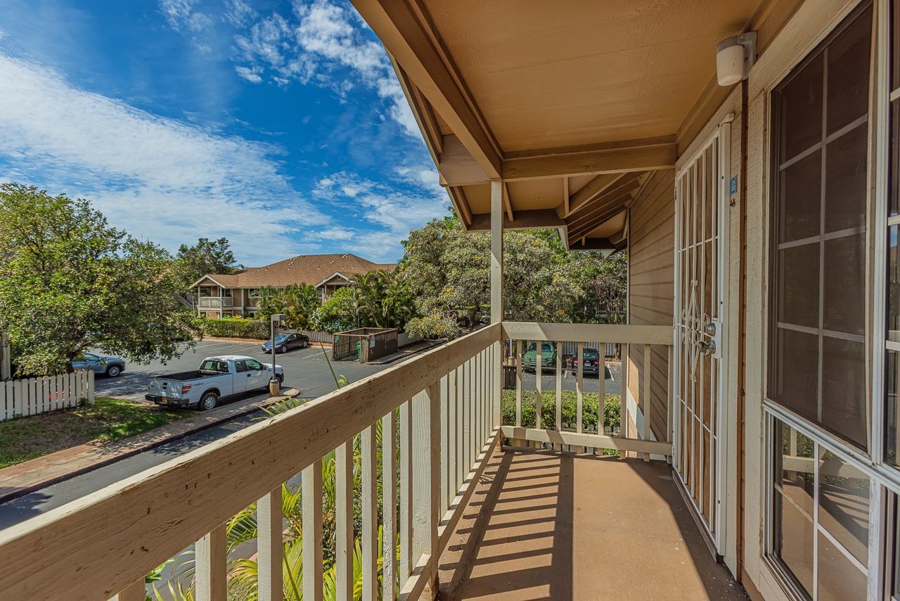 140 Uwapo Road, Unit 24202 Kihei, HI 96753 - Photo 29 of 45 a view of balcony with couches and wooden fence