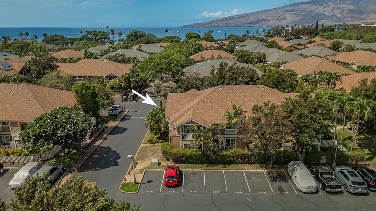 140 Uwapo Road, Unit 24202 Kihei, HI 96753 - Photo 3 of 45 an aerial view of a houses with yard