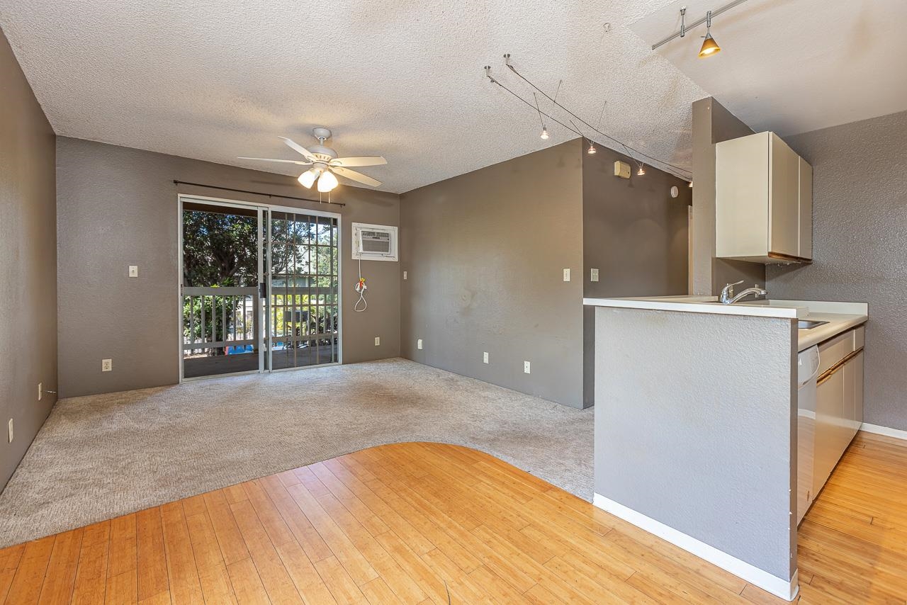 140 Uwapo Road, Unit 24202 Kihei, HI 96753 - Photo 4 of 45 a view of a kitchen with a sink and a window