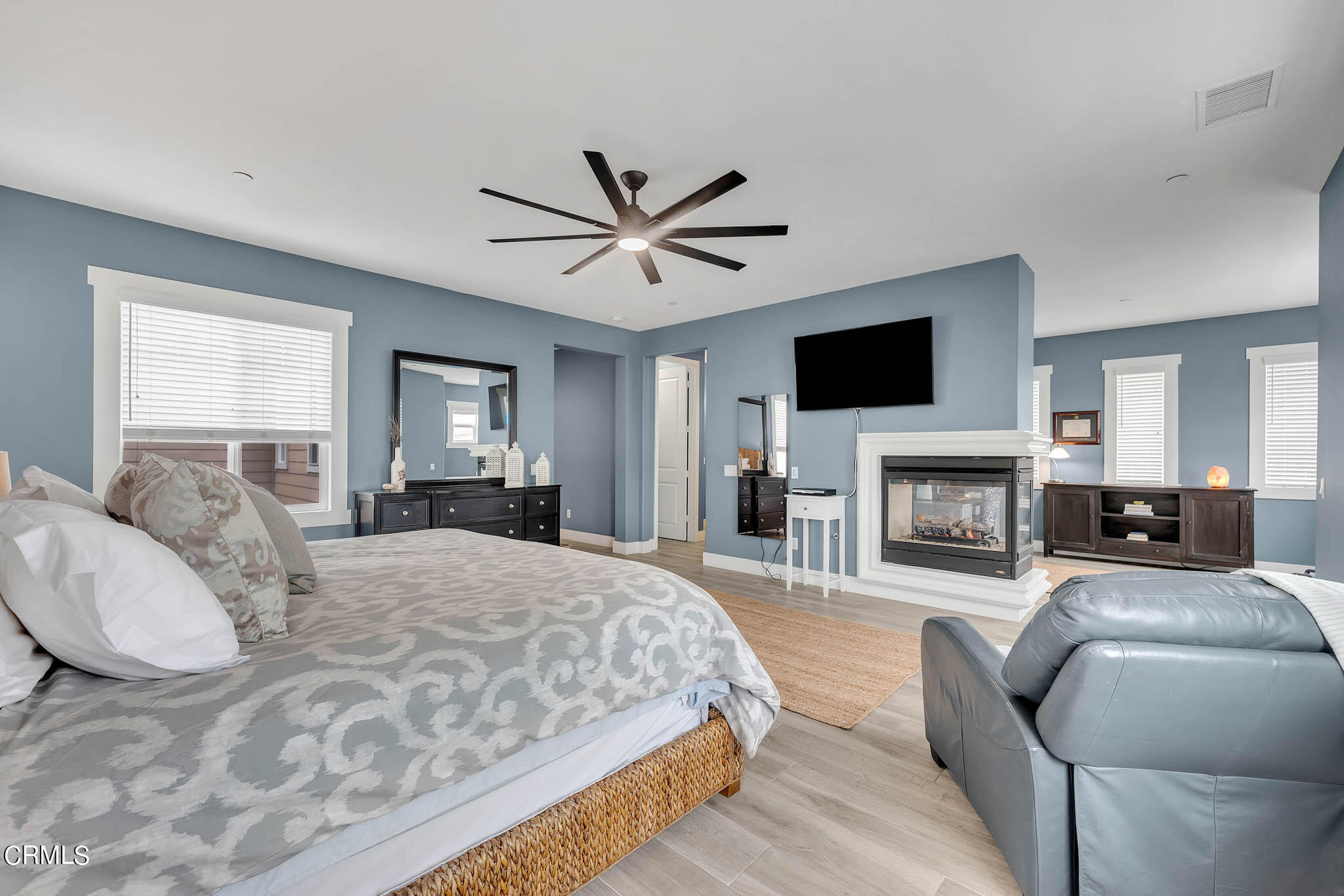 1465 Donegal Way Oxnard, CA 93035 - Photo 16 of 45 a spacious bedroom with a large bed and a fireplace