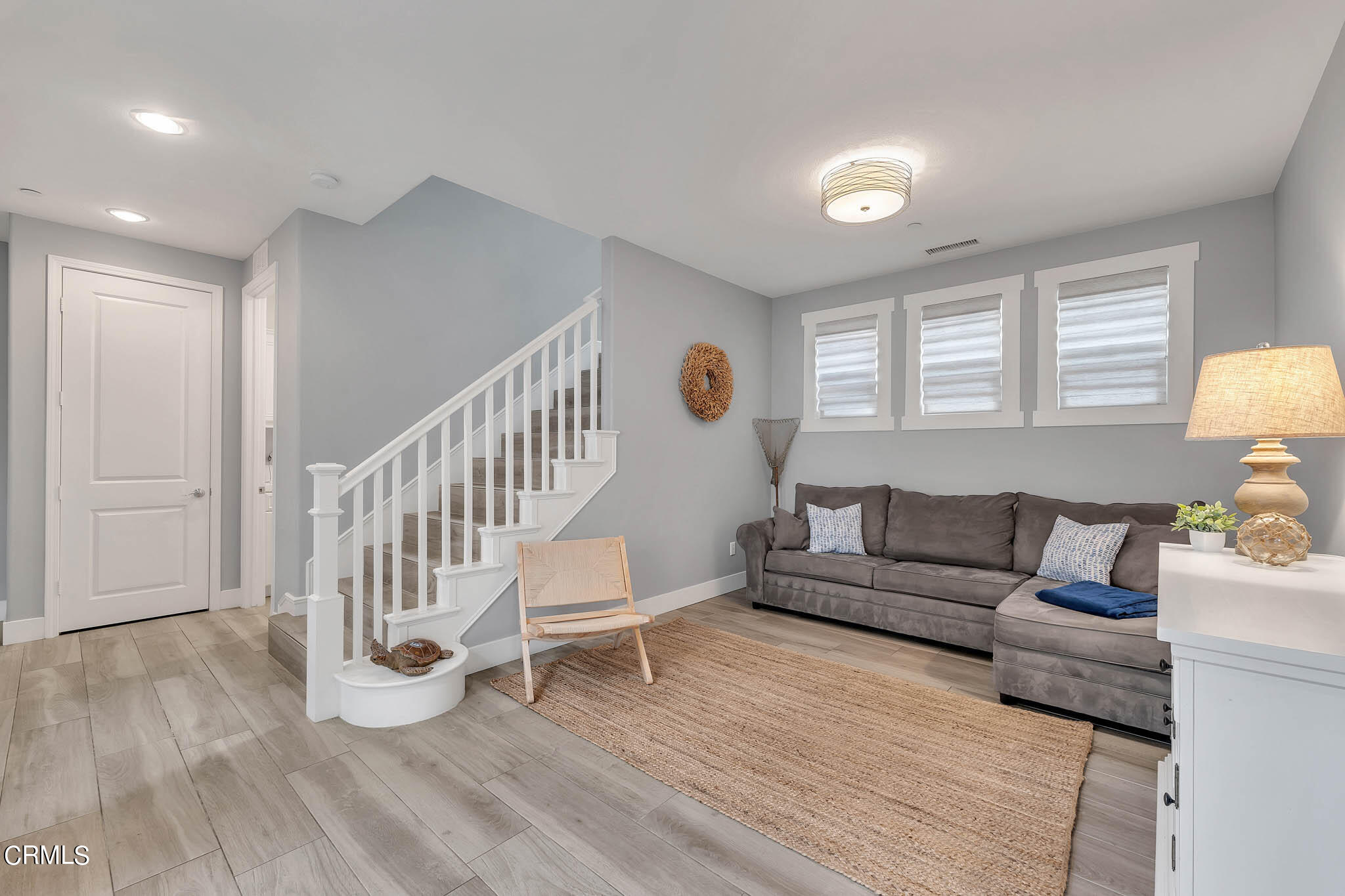 1465 Donegal Way Oxnard, CA 93035 - Photo 22 of 45 a living room with furniture and a wooden floor