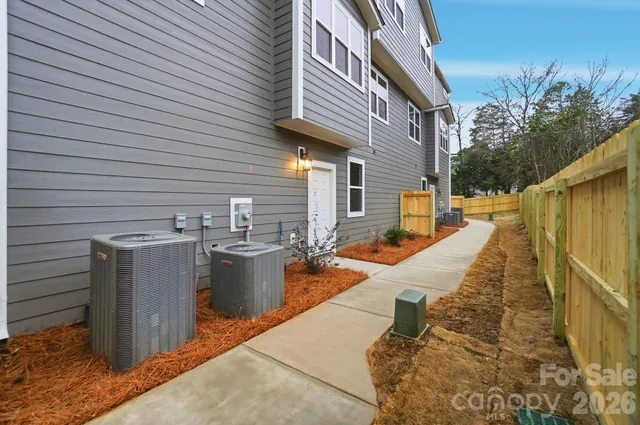 a view of a patio with couches chairs and potted plants