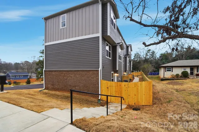 a view of a house with snow on the road