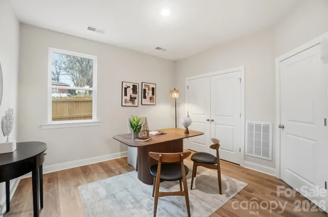 a view of a workspace with furniture