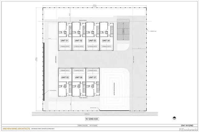 a view of a white building and glass door