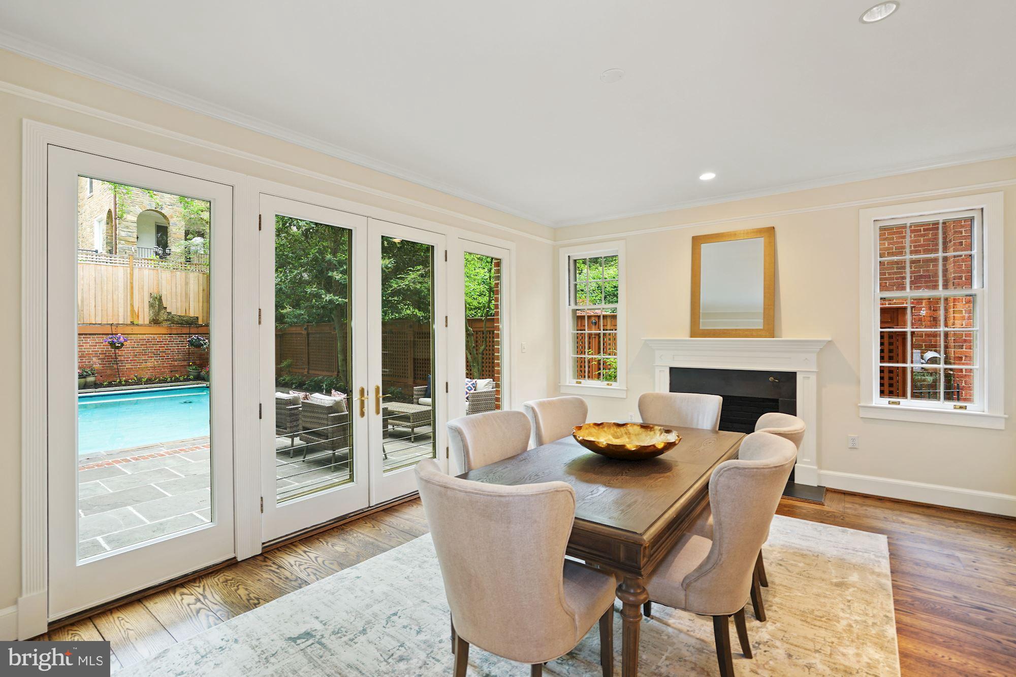 2468 Belmont Road Northwest Washington, DC 20008 - Photo 9 of 28 Dining room with wall of windows overlooking pool