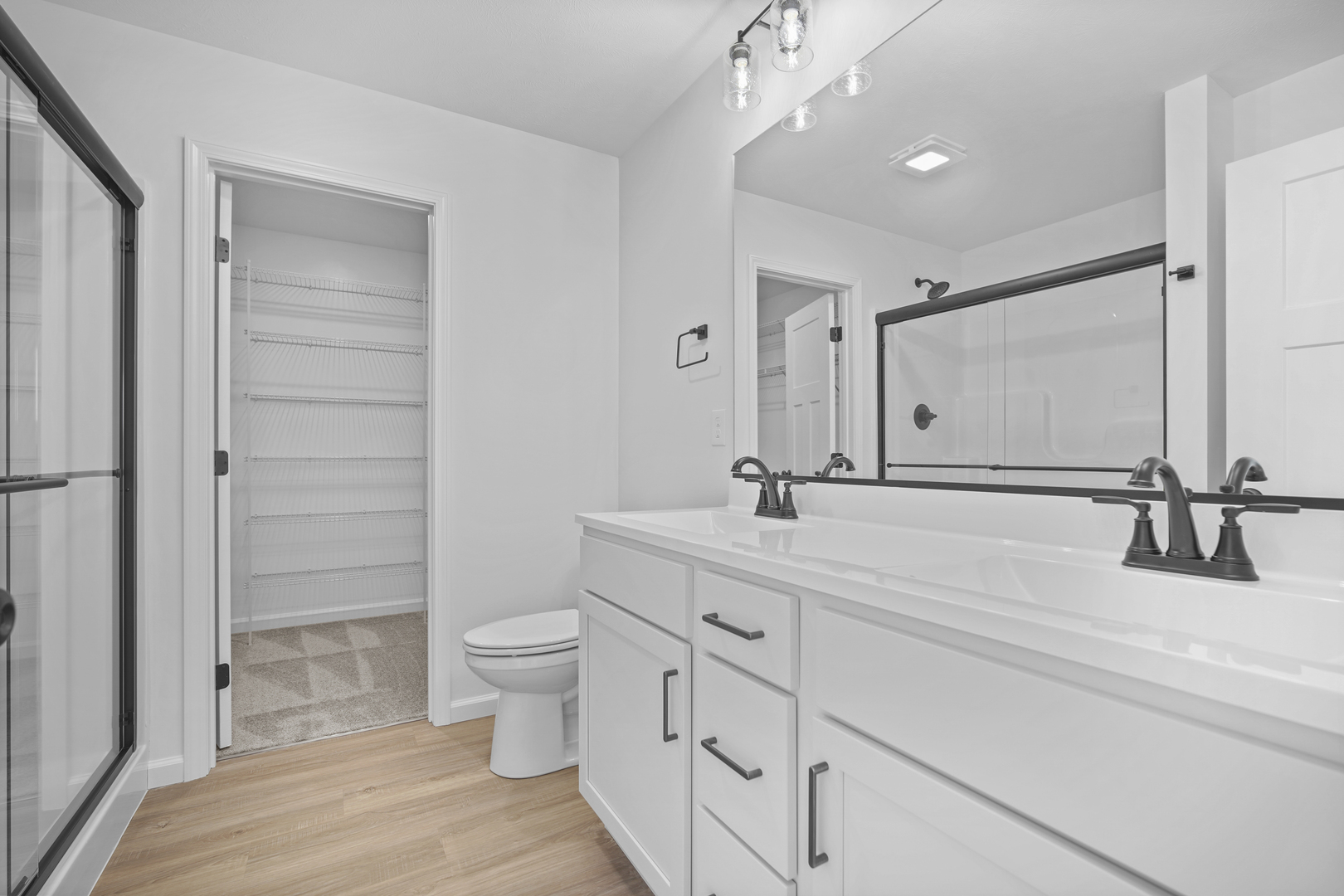 3 Eric Court Bloomington, IL 61705 - Photo 17 of 29 a bathroom with a double vanity sink toilet and shower