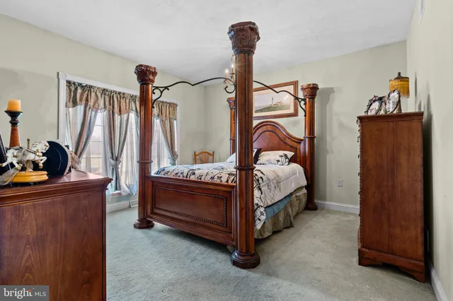 a kitchen with stainless steel appliances granite countertop a stove refrigerator sink and cabinets